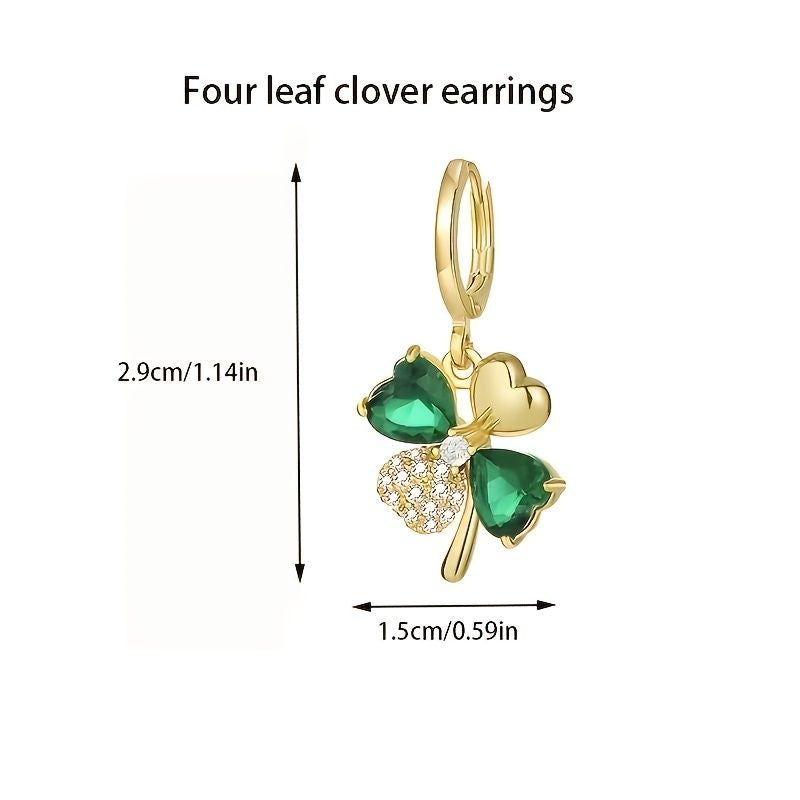 Gold four leaf clover earrings with green gemstones and measurements on a white background