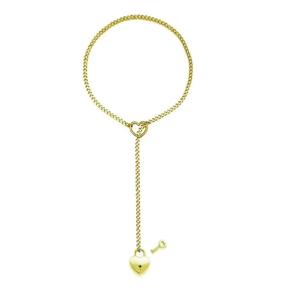 Gold chain bracelet with heart and key pendants on a white background
